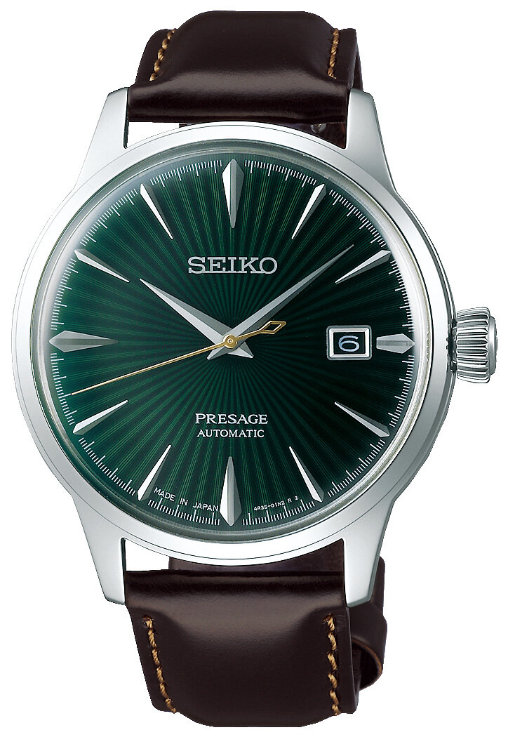 Klocka från Seiko med brunt läderarmband och grön boett